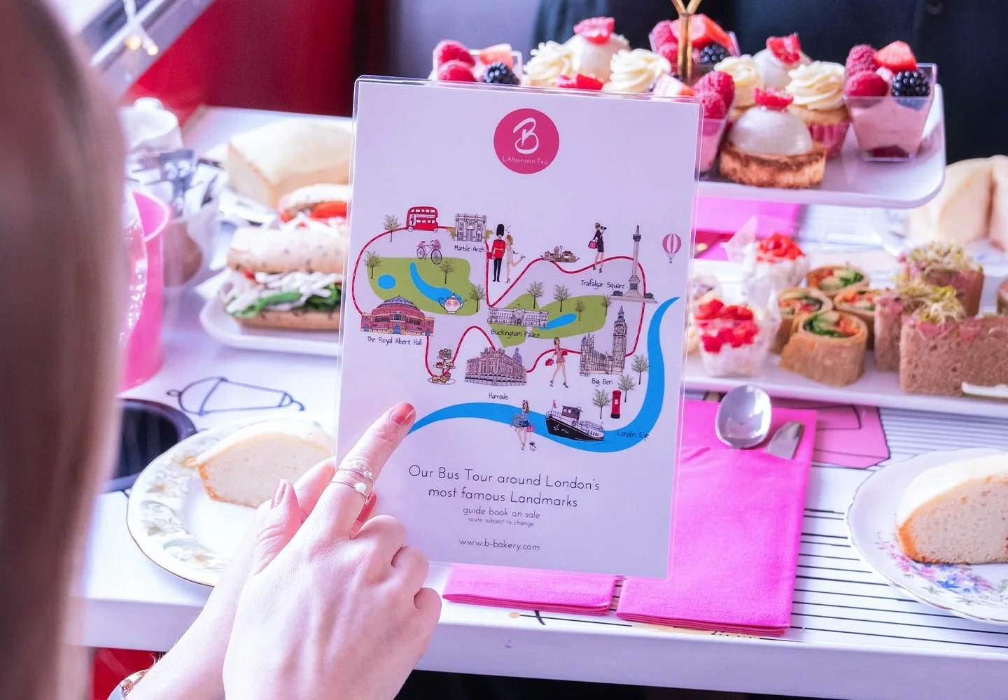 Afternoon tea setting and London route illustration on a Brigit’s Bakery bus